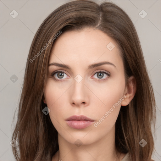 Neutral white young-adult female with long  brown hair and brown eyes