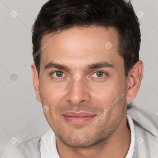 Joyful white adult male with short  brown hair and brown eyes