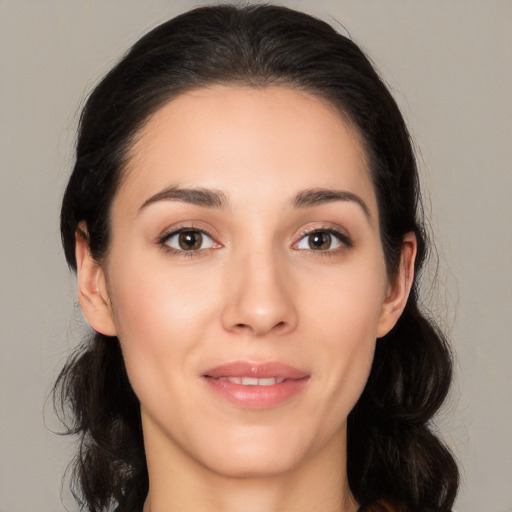 Joyful white young-adult female with medium  brown hair and brown eyes