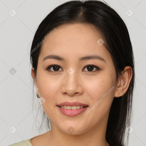 Joyful asian young-adult female with long  brown hair and brown eyes