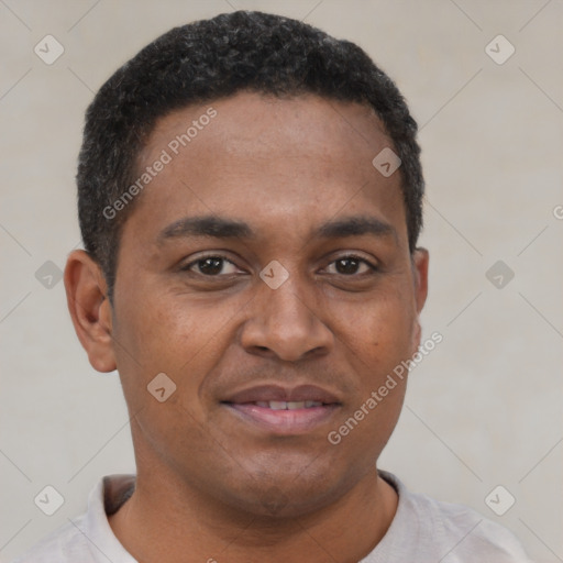 Joyful latino young-adult male with short  brown hair and brown eyes