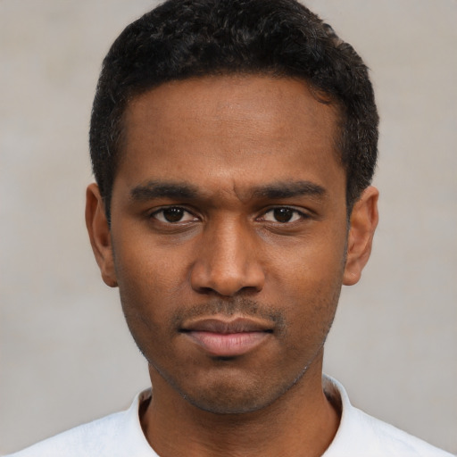 Neutral black young-adult male with short  black hair and brown eyes