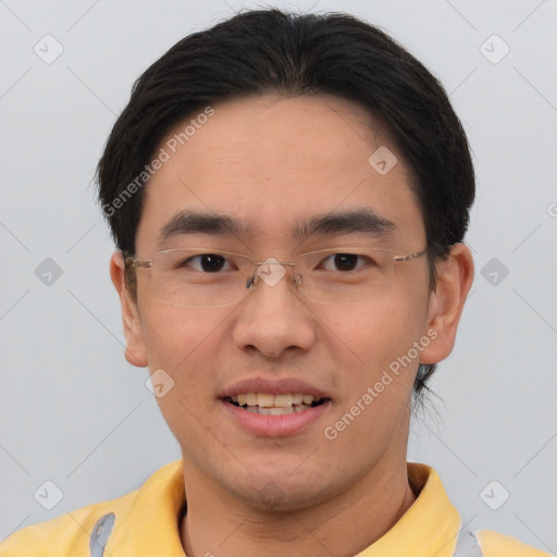 Joyful asian young-adult male with short  brown hair and brown eyes