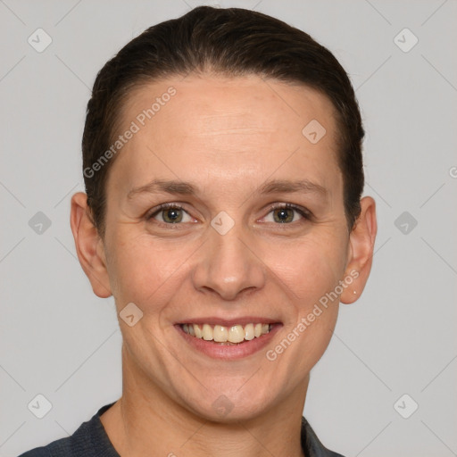 Joyful white adult female with short  brown hair and grey eyes