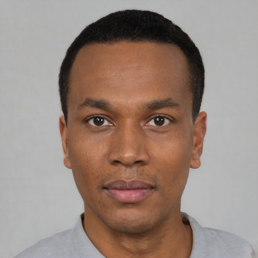 Neutral black young-adult male with short  black hair and brown eyes