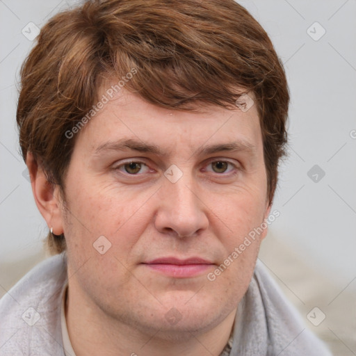 Joyful white adult male with short  brown hair and grey eyes