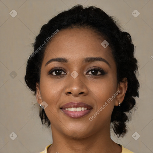 Joyful black young-adult female with medium  black hair and brown eyes