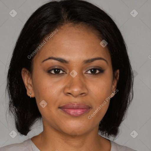 Joyful black adult female with medium  brown hair and brown eyes