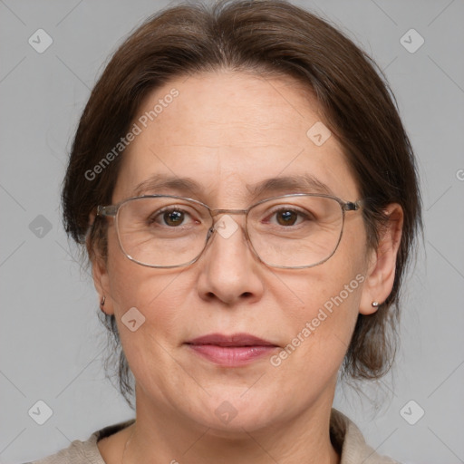 Joyful white adult female with medium  brown hair and grey eyes