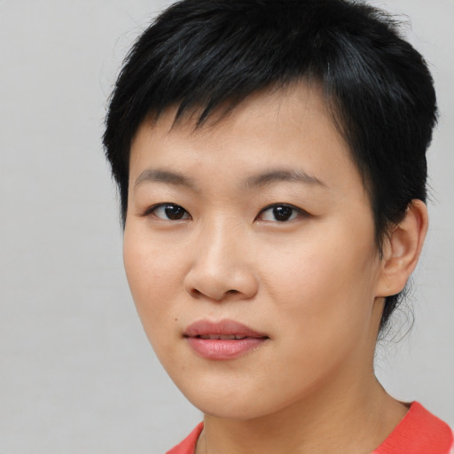 Joyful asian young-adult female with medium  black hair and brown eyes
