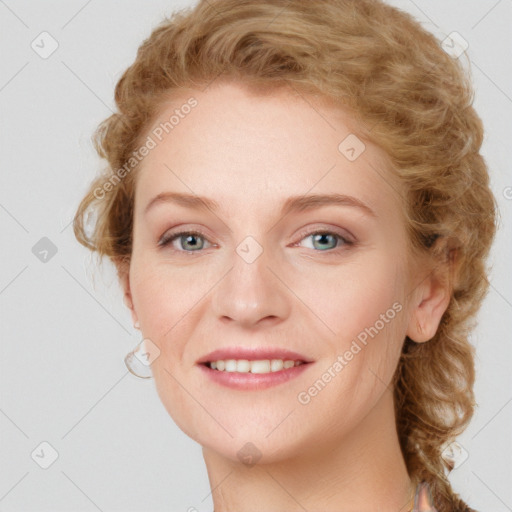 Joyful white young-adult female with medium  brown hair and blue eyes