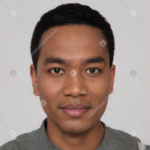 Joyful black young-adult male with short  black hair and brown eyes