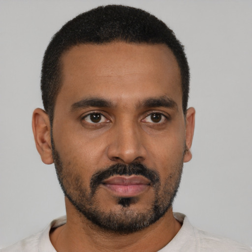 Neutral black young-adult male with short  black hair and brown eyes