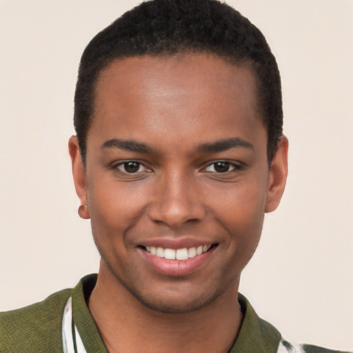 Joyful black young-adult male with short  brown hair and brown eyes