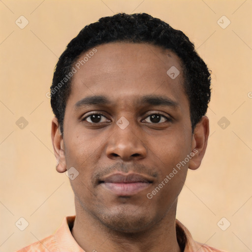 Neutral latino young-adult male with short  black hair and brown eyes