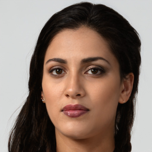 Neutral latino young-adult female with long  brown hair and brown eyes