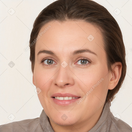 Joyful white adult female with medium  brown hair and brown eyes