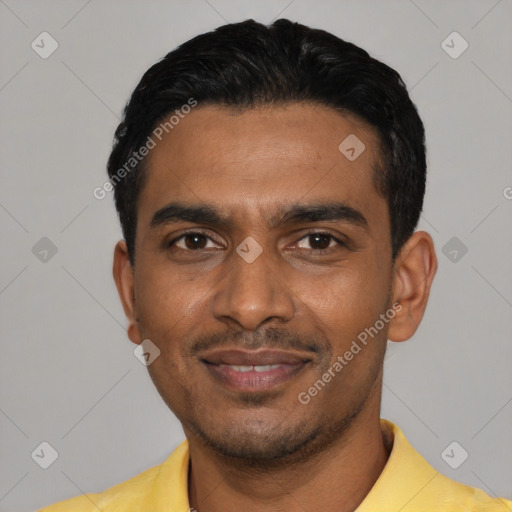 Joyful black young-adult male with short  black hair and brown eyes