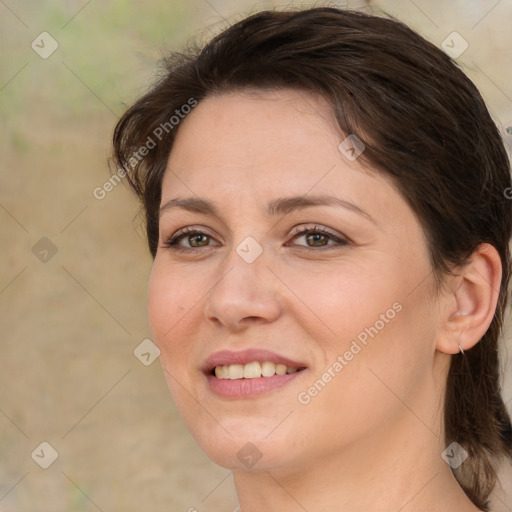 Joyful white adult female with medium  brown hair and brown eyes