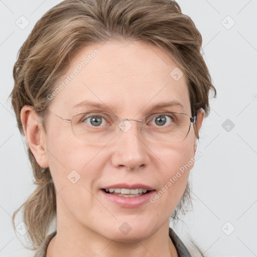 Joyful white adult female with medium  brown hair and blue eyes