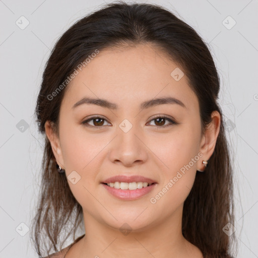 Joyful white young-adult female with long  brown hair and brown eyes