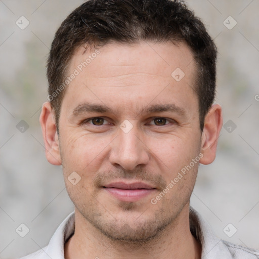 Joyful white young-adult male with short  brown hair and brown eyes