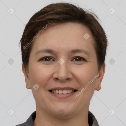 Joyful white adult female with short  brown hair and brown eyes