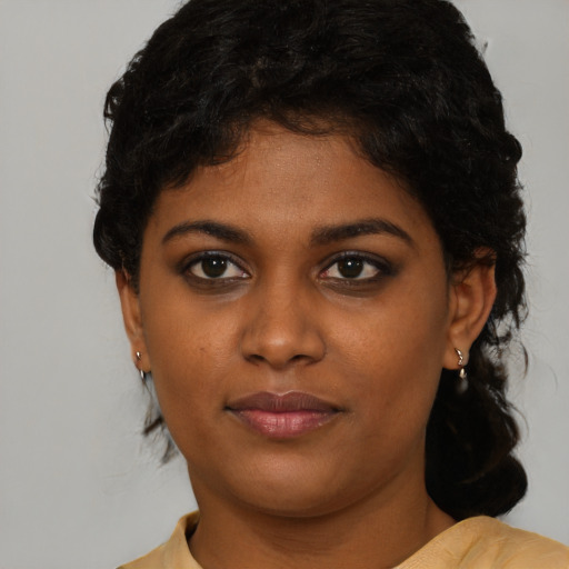 Neutral black young-adult female with short  black hair and brown eyes