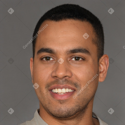 Joyful black young-adult male with short  black hair and brown eyes