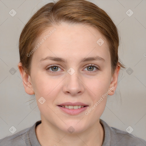 Joyful white young-adult female with medium  brown hair and grey eyes