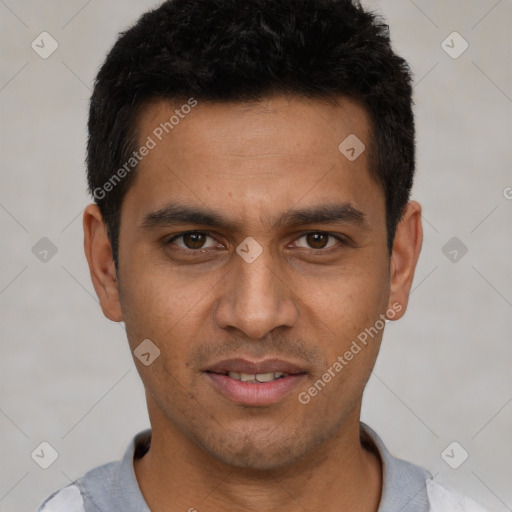 Joyful latino young-adult male with short  black hair and brown eyes