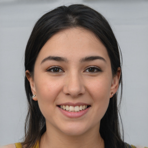 Joyful white young-adult female with medium  brown hair and brown eyes