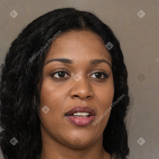 Joyful black young-adult female with long  black hair and brown eyes