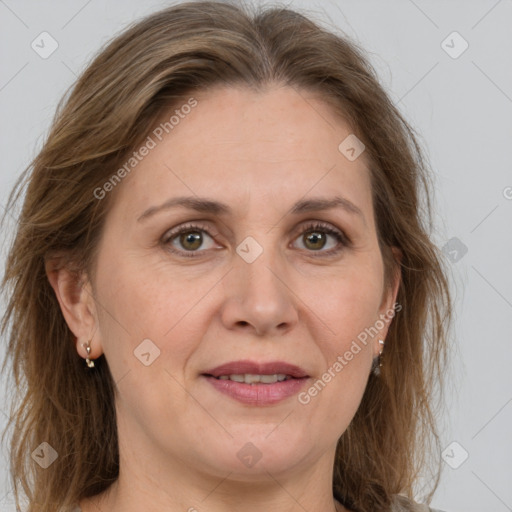 Joyful white adult female with medium  brown hair and grey eyes