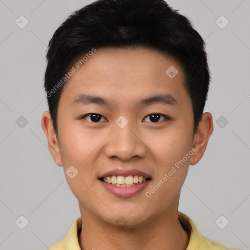 Joyful asian young-adult male with short  black hair and brown eyes