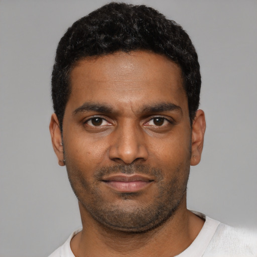 Neutral black young-adult male with short  black hair and brown eyes