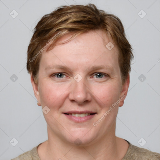 Joyful white adult female with short  brown hair and grey eyes