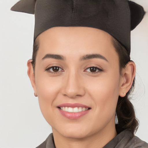 Joyful white young-adult female with short  black hair and brown eyes