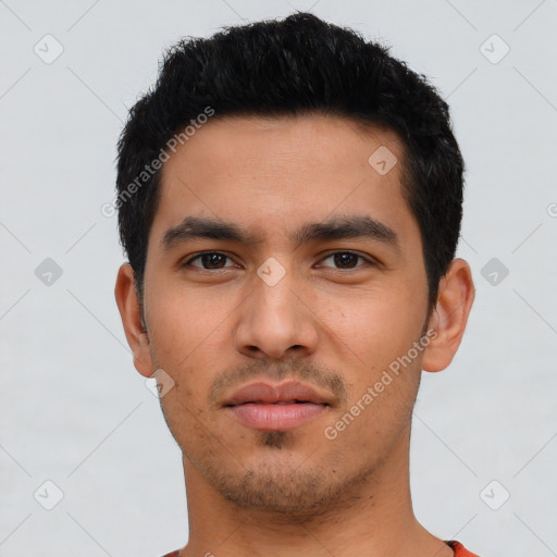 Neutral latino young-adult male with short  black hair and brown eyes