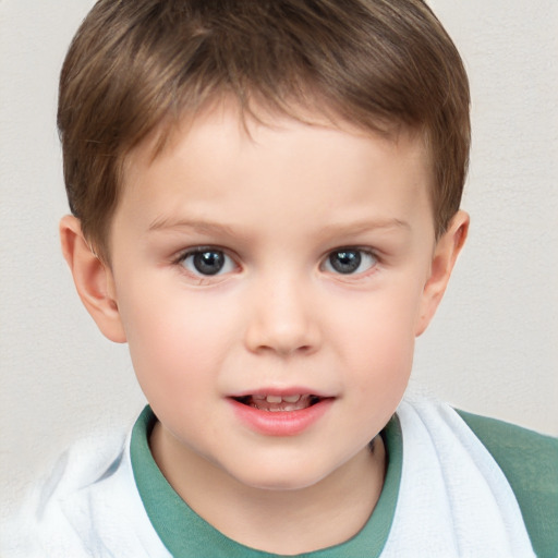 Joyful white child male with short  brown hair and brown eyes