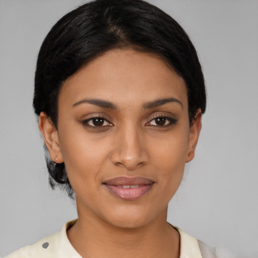 Joyful asian young-adult female with short  black hair and brown eyes