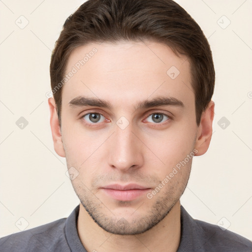 Neutral white young-adult male with short  brown hair and grey eyes