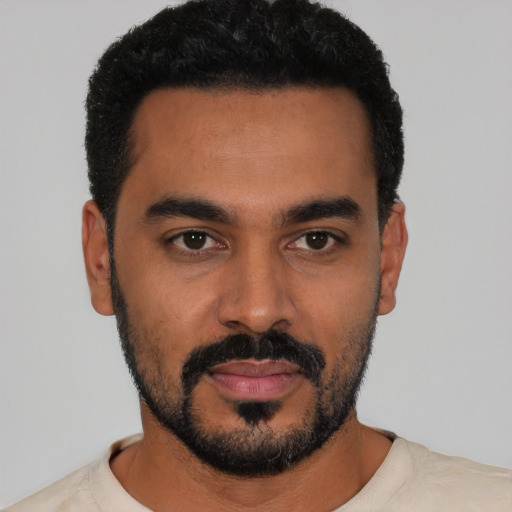 Neutral latino young-adult male with short  black hair and brown eyes