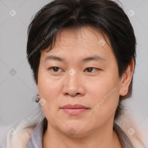 Joyful white adult female with medium  brown hair and brown eyes