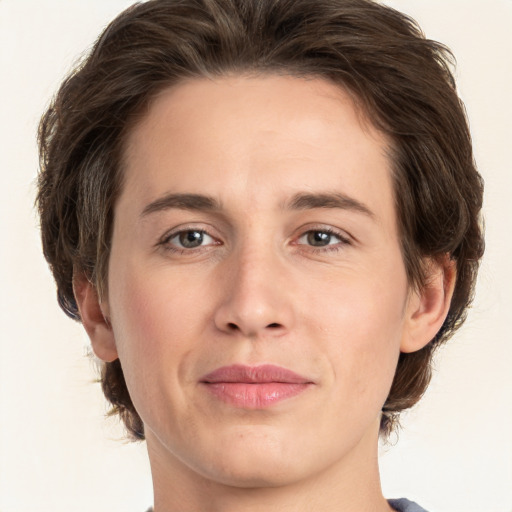 Joyful white young-adult male with medium  brown hair and brown eyes