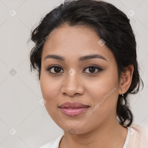 Joyful latino young-adult female with medium  brown hair and brown eyes