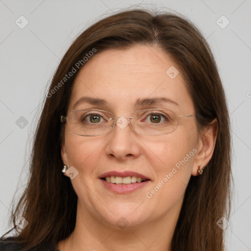 Joyful white adult female with long  brown hair and grey eyes