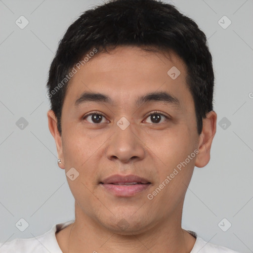 Joyful asian young-adult male with short  black hair and brown eyes