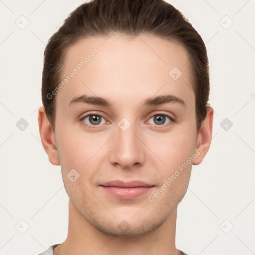 Joyful white young-adult male with short  brown hair and grey eyes