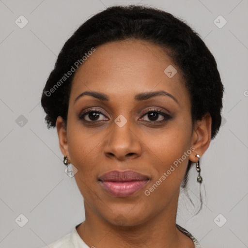 Joyful black adult female with short  black hair and brown eyes